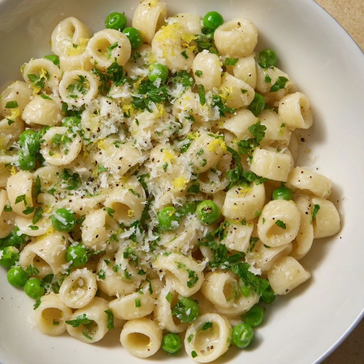 Tender ditalini pasta coated in a glistening garlic butter sauce, sprinkled with fresh Parmesan cheese.