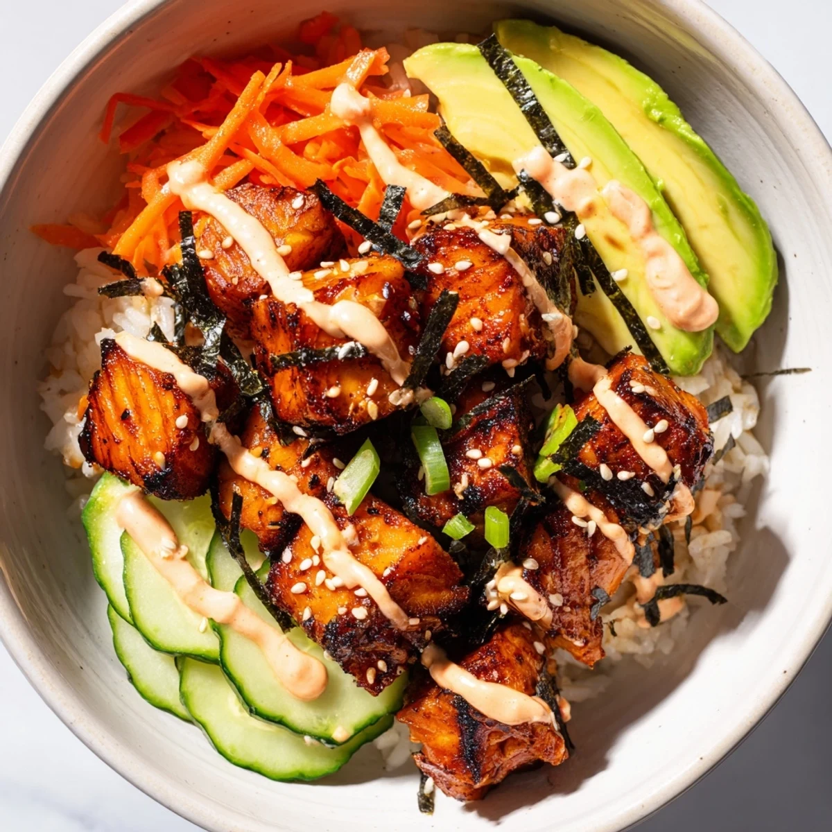 A delicious and creamy Salmon Bites Bowl, featuring tender, flavorful salmon with spicy mayo.