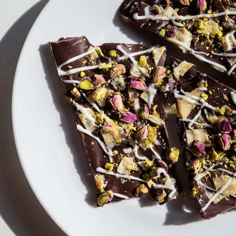 A beautiful close-up of Pistachio Dubai Chocolate Bark, a stunning homemade dessert studded with nuts.