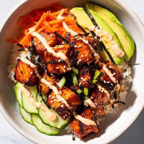 A delicious and creamy Salmon Bites Bowl, featuring tender, flavorful salmon with spicy mayo.