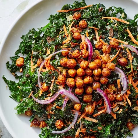 Close-up of a vibrant kale salad with roasted chickpeas: a healthy and delicious meal.