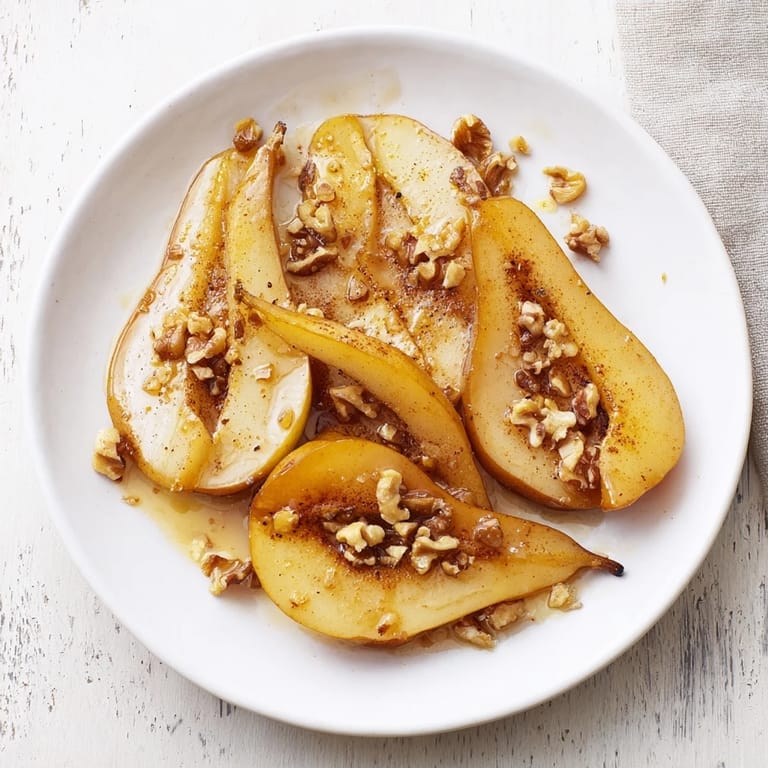 Warm Maple-Warm Cozy Plate: Caramelized Pear and Walnut Bake, with a scoop of cool vanilla ice cream, offers a perfect dessert.