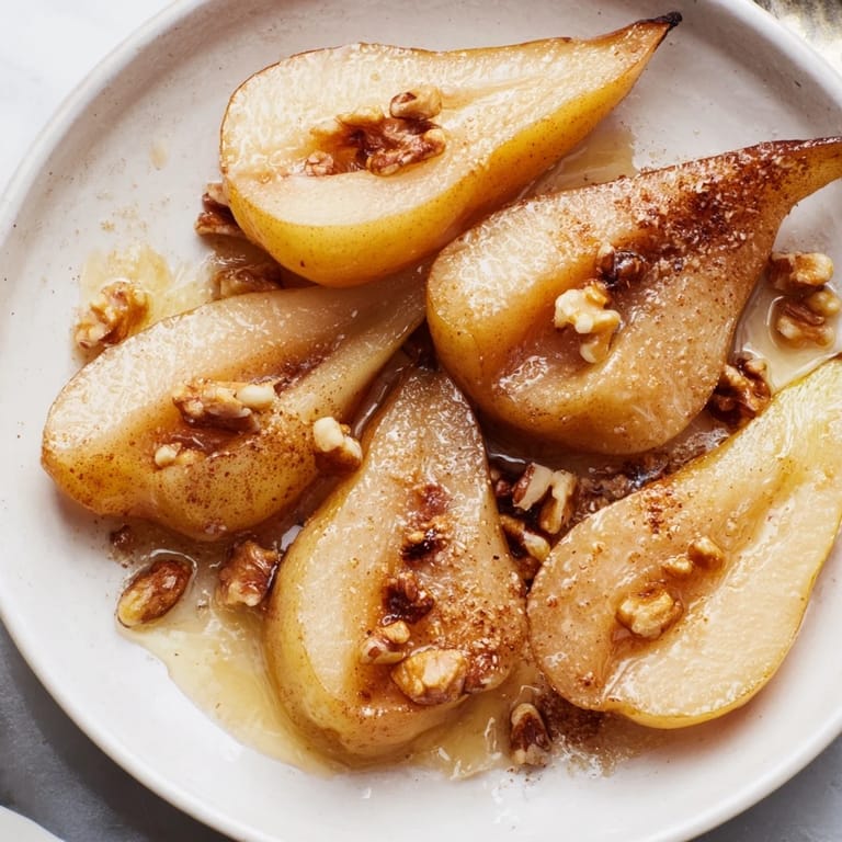 Sweet Maple-Warm Cozy Plate: Caramelized Pear and Walnut Bake featuring golden brown pears and toasted walnuts, ready to be enjoyed.