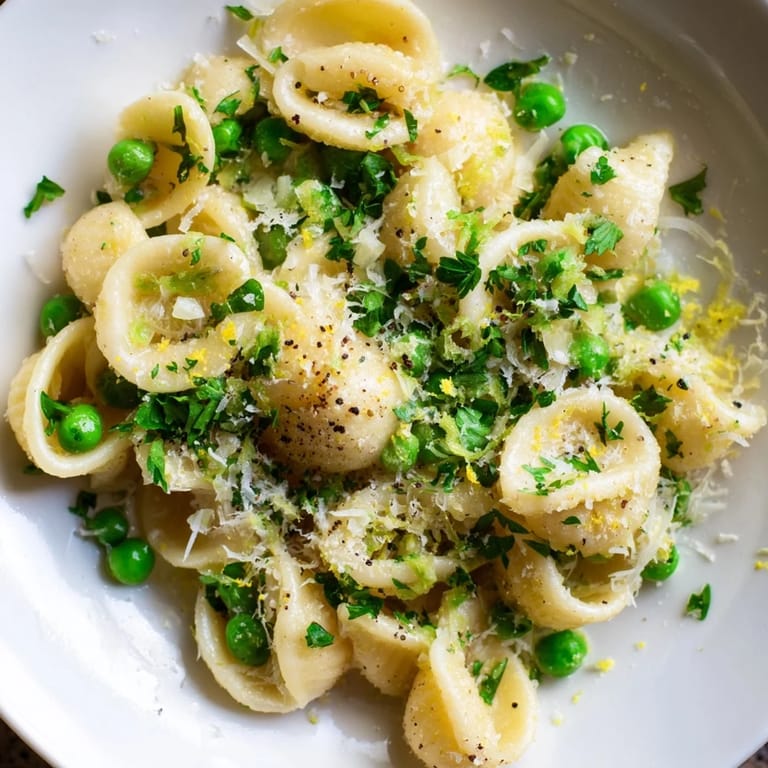 This comforting bowl of Garlic Butter Ditalini includes bright peas and smells of delicious garlic.